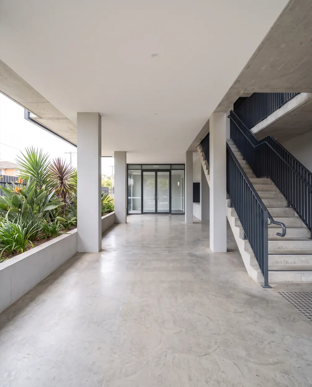 Common-property entry and stairwell of a Brisbane apartment complex